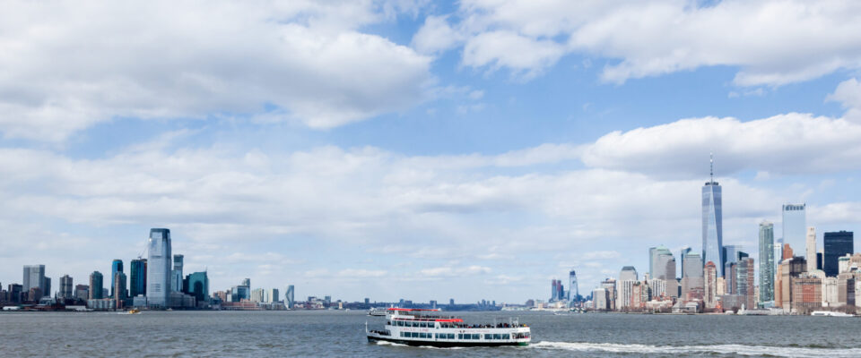New York, New York - April 5, 2018: A Circle Line Cruise boat travels along the Hudson River